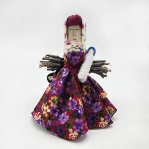 عروسک بومی دست ساز سیاه رودبار با هیمه و دامن گل بنفش